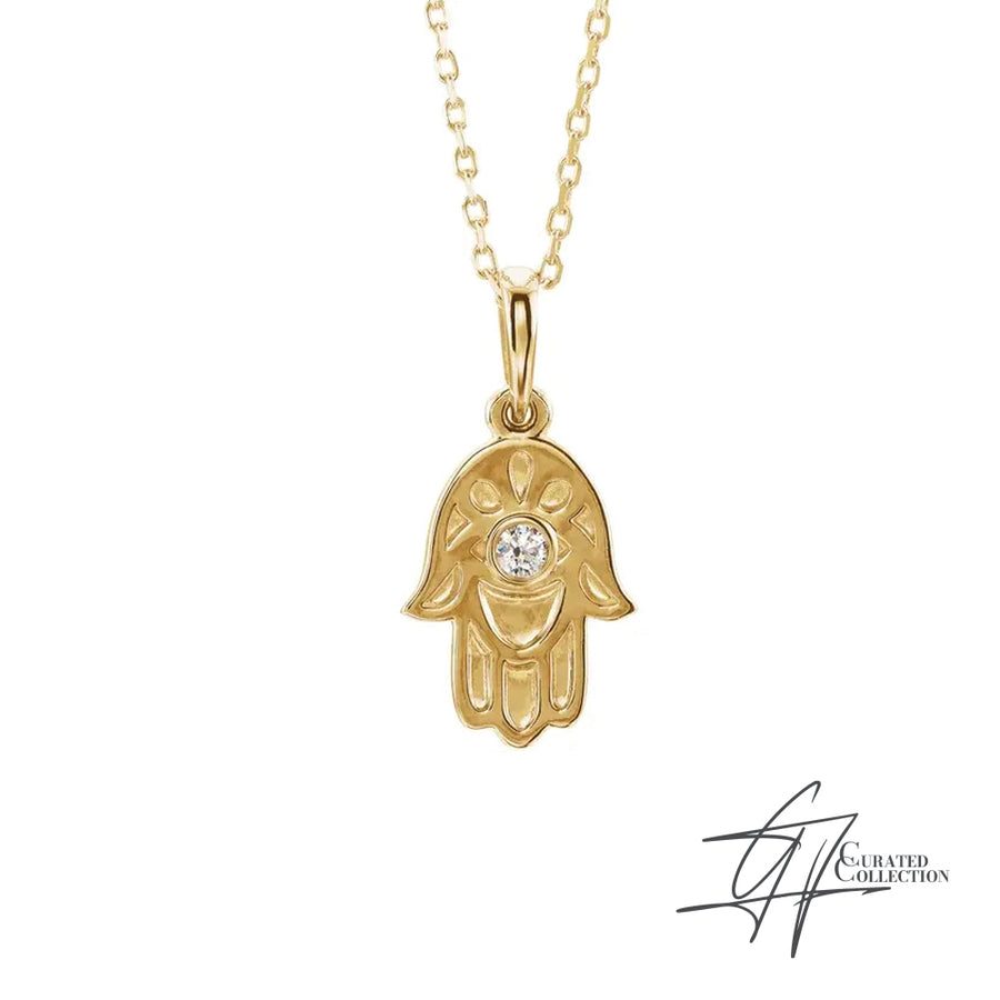 Gradiance Jewelry women's 14KT yellow gold hamsa hand Protection Necklace from the Curated Collection.