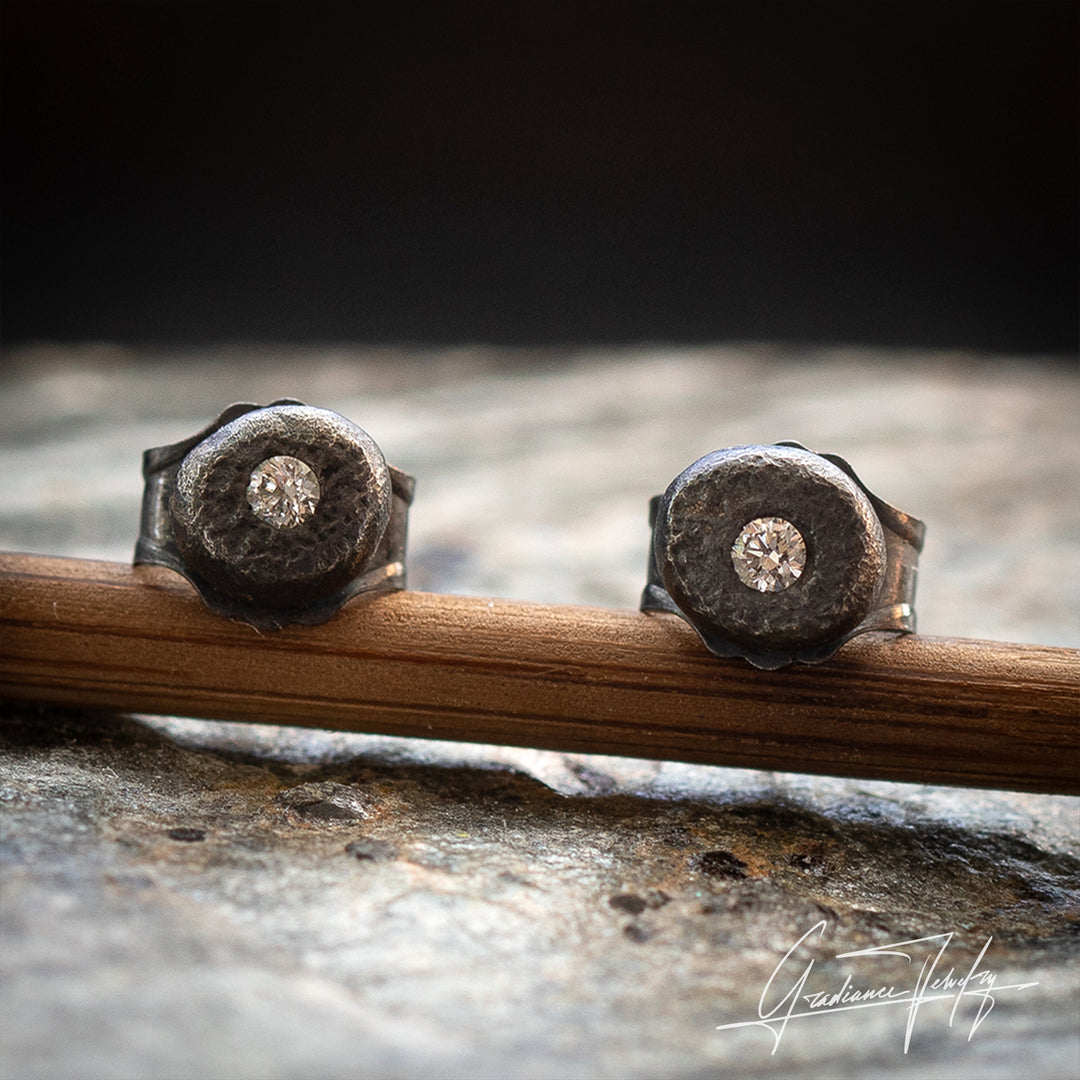 Gradiance Jewelry Oxidized Silver and Diamond Carbon Chronicle men's studs from the Relic Collection - close up.