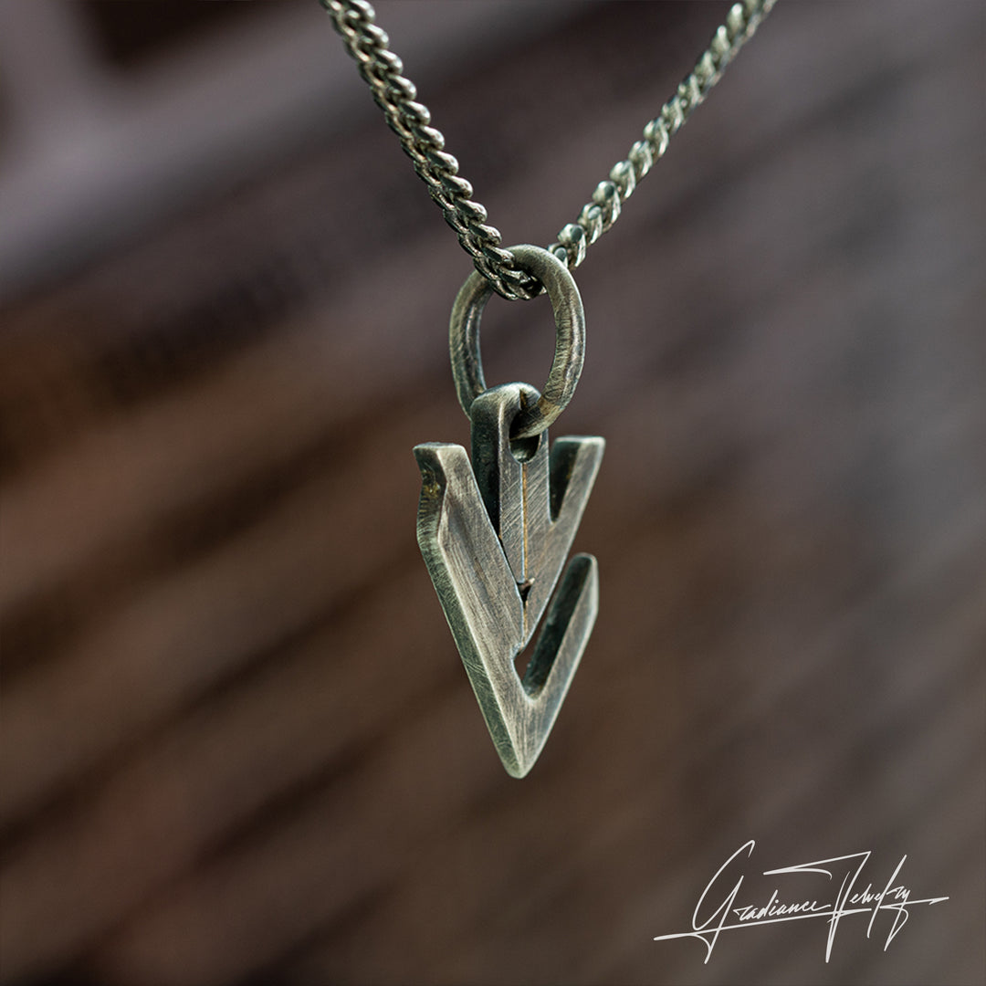 Gradiance Jewelry men's oxidized silver Downward Drift pendant featuring an arrow shaped design from our the Relic Collection - side view.