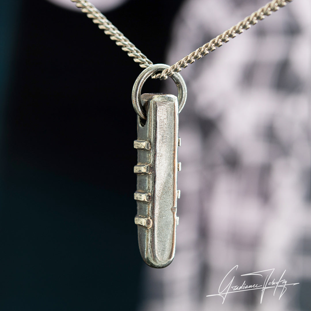 Gradiance Jewelry men's oxidized silver Fretway Pendant featuring a guitar fret design from the Relic Collection - side view.