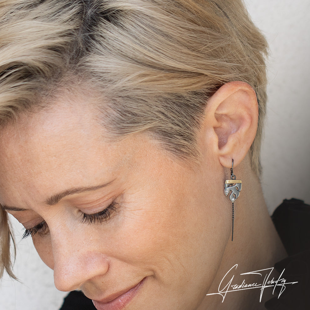 Gradiance Jewelry women's oxidized silver and 18KT yellow gold Growth Earring threader set with lab-created VS quality diamonds and a mini monstera leaf design from our Growth Collection - close up shown on model
