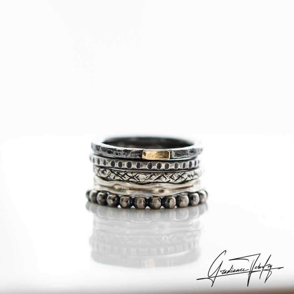 Gradiance Jewelry oxidized silver and 18KT yellow gold Mega Stacker Ring set from the Little Black Jewelry Collection - product shot.