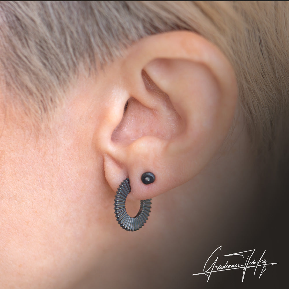 Gradiance Jewelry women's oxidized silver Radiant hoop earrings from the "Little Black Jewelry" collection - model shot.