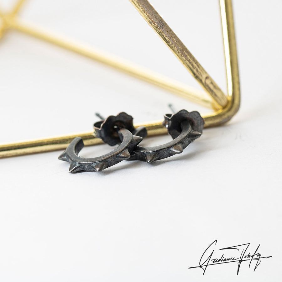Gradiance Jewelry women's oxidized silver small spike Moto hoop earrings from the "Little Black Jewelry" collection - product shot.